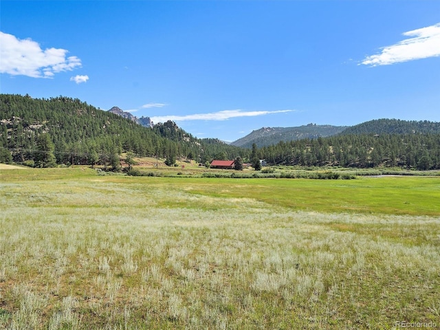 mountain view featuring a rural view