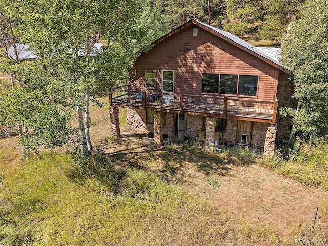 view of front of property featuring a wooden deck