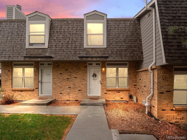 1517 S Owens St Unit 9, Denver, CO 80232 - multi unit property featuring a shingled roof, brick siding, and mansard roof