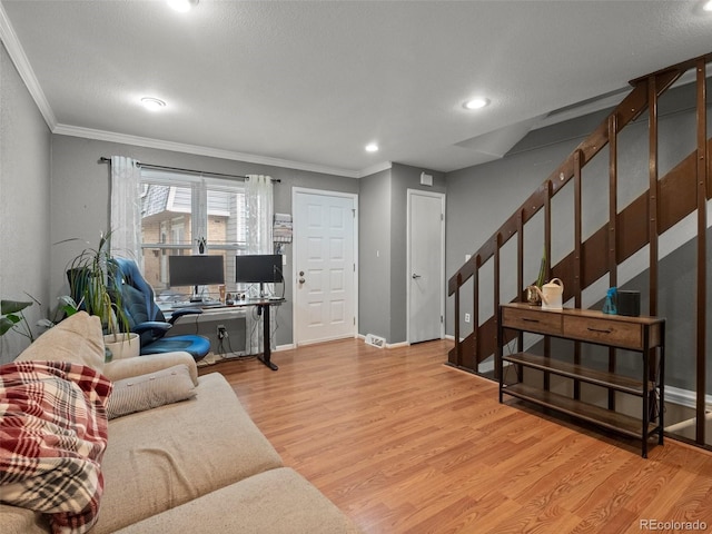 1517 S Owens St Unit 9, Denver, CO 80232 - living area featuring crown molding, stairway, wood finished floors, and baseboards