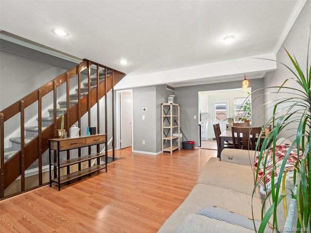 1517 S Owens St Unit 9, Denver, CO 80232 - living room featuring recessed lighting, baseboards, visible vents, wood finished floors, and stairway