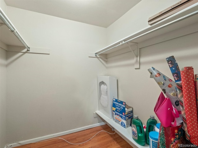 1517 S Owens St Unit 9, Denver, CO 80232 - spacious closet featuring wood finished floors