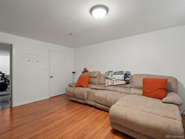 1517 S Owens St Unit 9, Denver, CO 80232 - living area featuring visible vents and light wood-style flooring