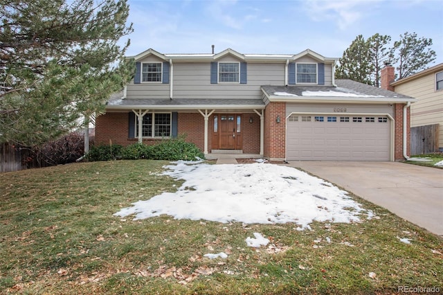 view of front property featuring a garage and a front lawn