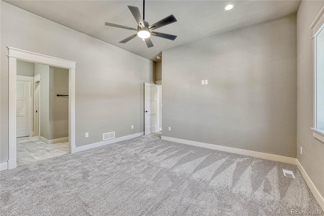 unfurnished bedroom featuring light carpet and ceiling fan