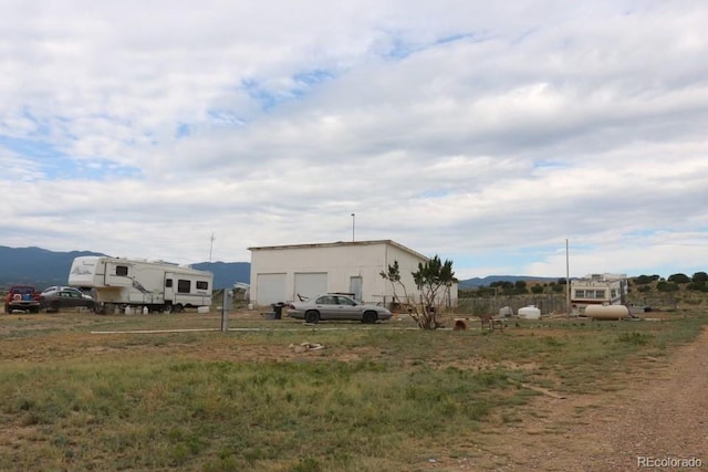 view of side of home featuring a mountain view