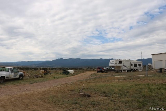 property view of mountains featuring a rural view