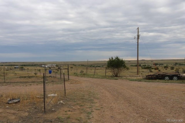 view of yard with a rural view