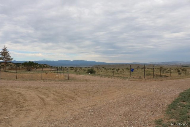 mountain view featuring a rural view