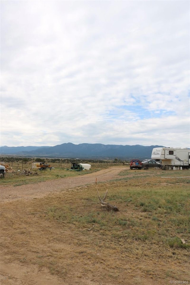 mountain view featuring a rural view