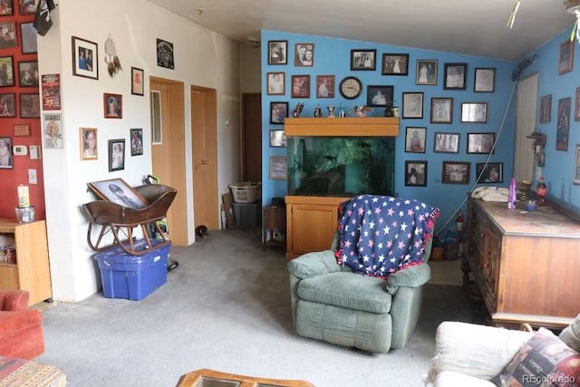 living room featuring carpet flooring and lofted ceiling