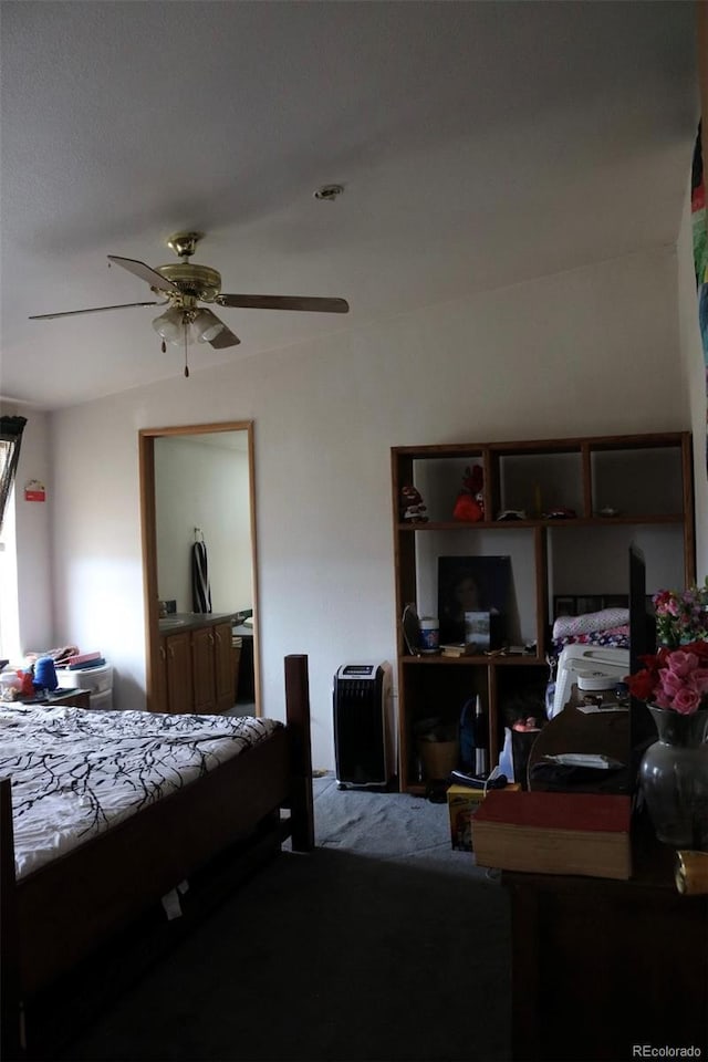 bedroom with ceiling fan and carpet floors