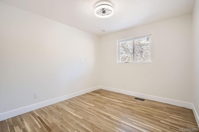 empty room featuring hardwood / wood-style floors