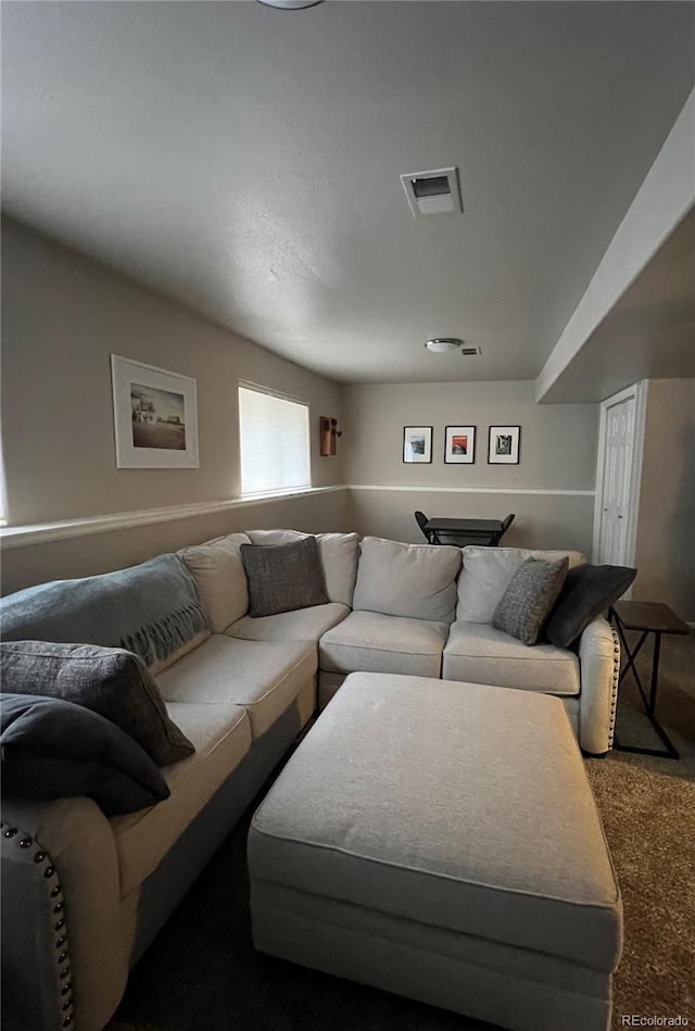 living room with carpet floors and visible vents