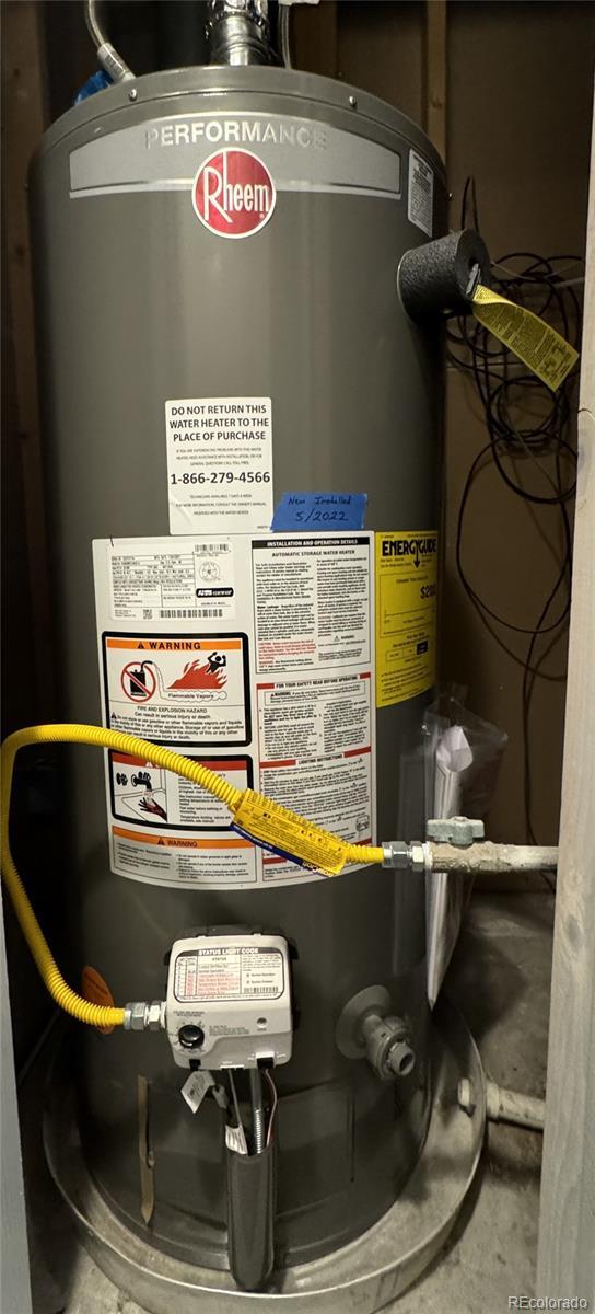 utility room featuring gas water heater