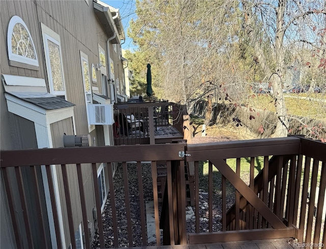 wooden terrace featuring cooling unit