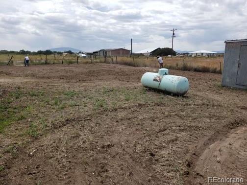 view of yard with a rural view