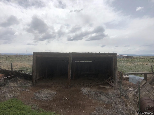 view of outbuilding with a rural view