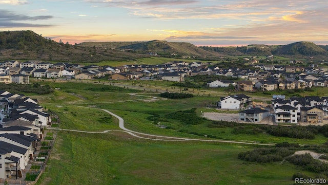 423 Rogers Way, Castle Rock, CO 80104 - aerial view at dusk of a residential view and a mountain view
