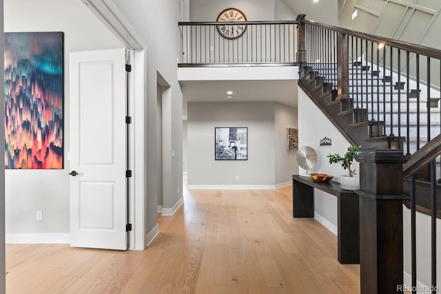 423 Rogers Way, Castle Rock, CO 80104 - foyer entrance with wood finished floors, stairway, and a high ceiling