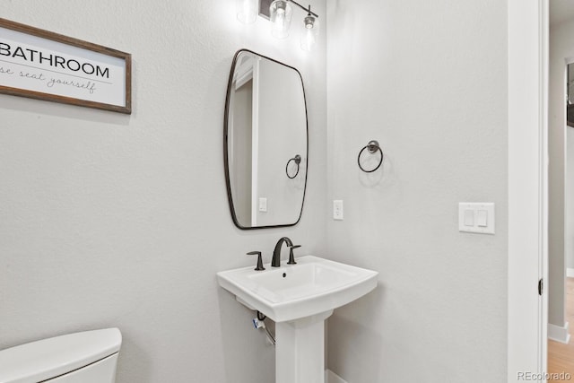 423 Rogers Way, Castle Rock, CO 80104 - bathroom featuring toilet and baseboards