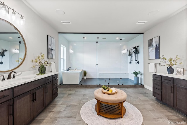 423 Rogers Way, Castle Rock, CO 80104 - full bathroom featuring two vanities, a shower stall, and a soaking tub