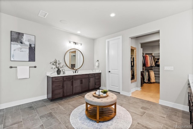 423 Rogers Way, Castle Rock, CO 80104 - full bathroom with vanity, recessed lighting, and a walk in closet