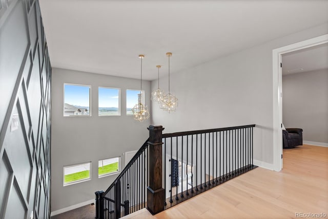 423 Rogers Way, Castle Rock, CO 80104 - stairway with wood finished floors and a chandelier