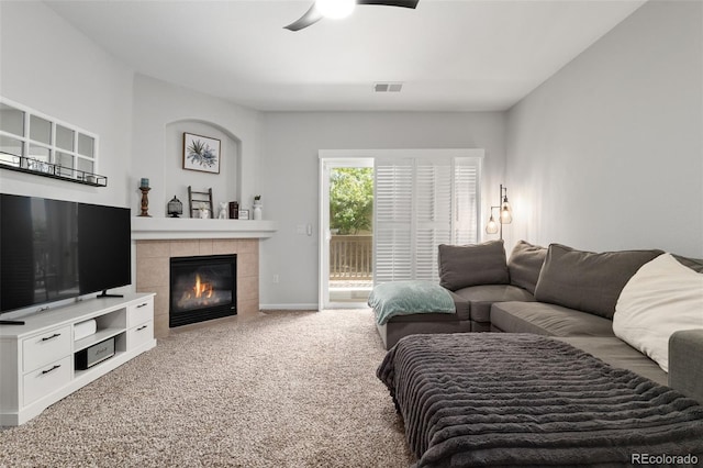 23346 E 5th Pl Unit 101, Aurora, CO 80018 - living room with ceiling fan, carpet, a tile fireplace, and baseboards