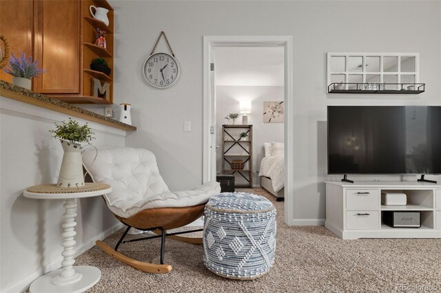 23346 E 5th Pl Unit 101, Aurora, CO 80018 - sitting room with baseboards and light colored carpet