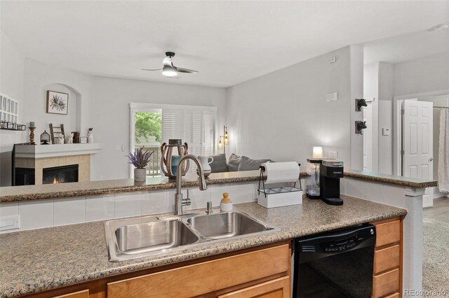 23346 E 5th Pl Unit 101, Aurora, CO 80018 - kitchen with black dishwasher, open floor plan, a sink, and a ceiling fan
