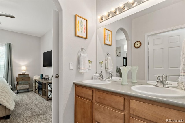 23346 E 5th Pl Unit 101, Aurora, CO 80018 - bathroom featuring connected bathroom and double vanity