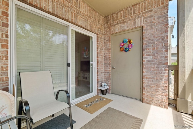 23346 E 5th Pl Unit 101, Aurora, CO 80018 - doorway to property with brick siding