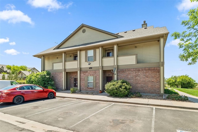 23346 E 5th Pl Unit 101, Aurora, CO 80018 - view of building exterior with uncovered parking