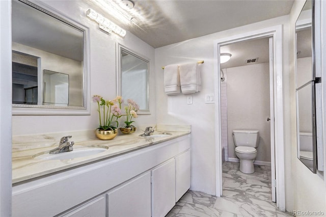 bathroom with toilet, a sink, visible vents, marble finish floor, and double vanity