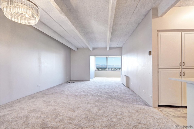 130 N Pearl St Unit 1606, Denver, CO 80203 - carpeted spare room featuring a textured ceiling and a chandelier