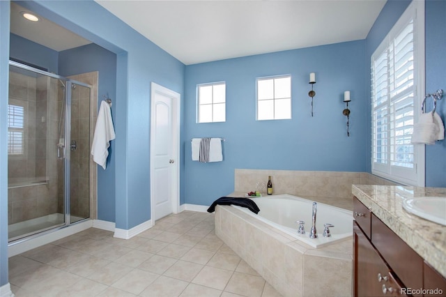 bathroom featuring tile patterned floors, vanity, and separate shower and tub