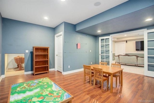 dining area featuring french doors and hardwood / wood-style flooring