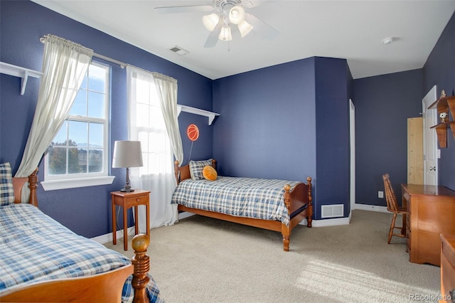 carpeted bedroom featuring ceiling fan