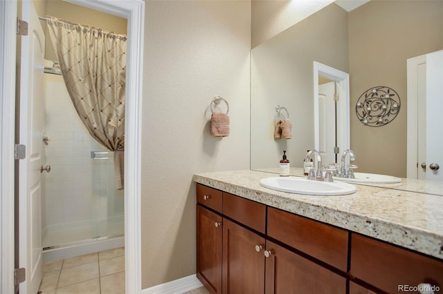 bathroom with tile patterned flooring, vanity, and a shower with shower door