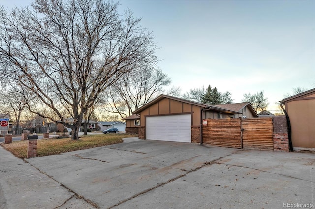 property exterior at dusk featuring a garage