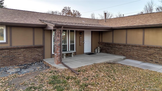 property entrance with a patio area