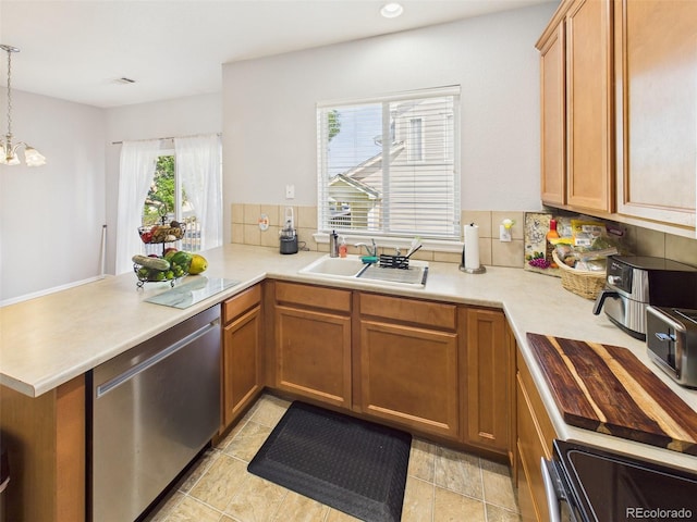 12912 Grant Cir Unit A, Thornton, CO 80241 - kitchen with dishwasher, a peninsula, electric range oven, light countertops, and decorative backsplash