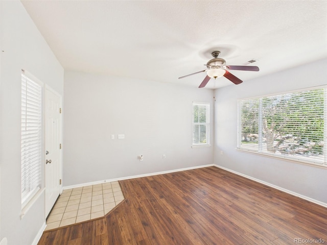 12912 Grant Cir Unit A, Thornton, CO 80241 - empty room featuring ceiling fan and wood finished floors