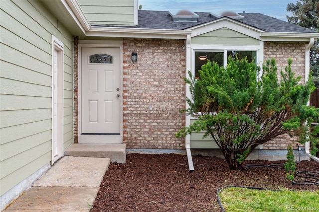 2777 S Sedalia St, Aurora, CO 80013 - property entrance with brick siding and a shingled roof