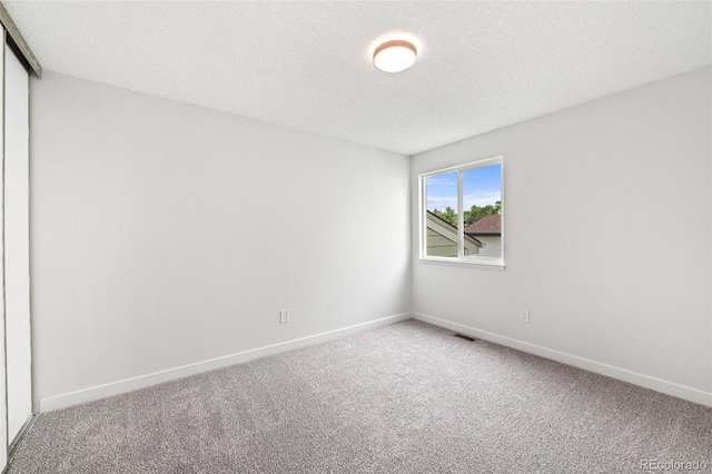 2777 S Sedalia St, Aurora, CO 80013 - carpeted spare room with baseboards and a textured ceiling