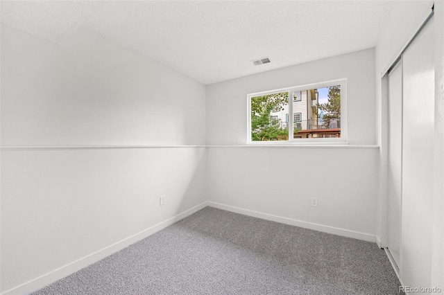 2777 S Sedalia St, Aurora, CO 80013 - unfurnished bedroom with carpet, a closet, and a textured ceiling