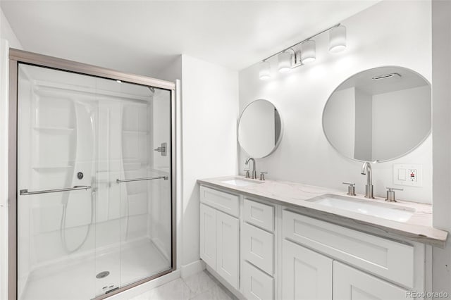 2777 S Sedalia St, Aurora, CO 80013 - full bathroom featuring a shower stall, double vanity, and marble finish floors