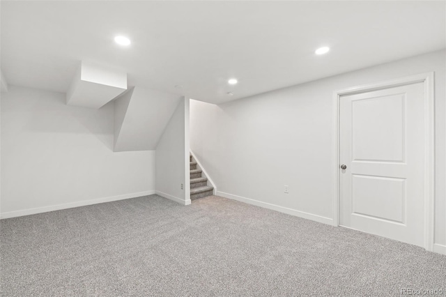2777 S Sedalia St, Aurora, CO 80013 - finished below grade area with carpet, stairs, and recessed lighting