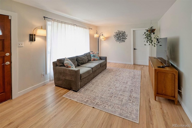 4425 E Harvard Ave, Denver, CO 80222 - living area featuring light wood finished floors and baseboards